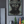 Framed artwork with 'ERROR 404' on a wall above a shelf with decorative items.
