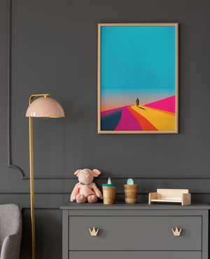 Framed abstract artwork on a dark gray wall with a lamp and small decorative items on a dresser.