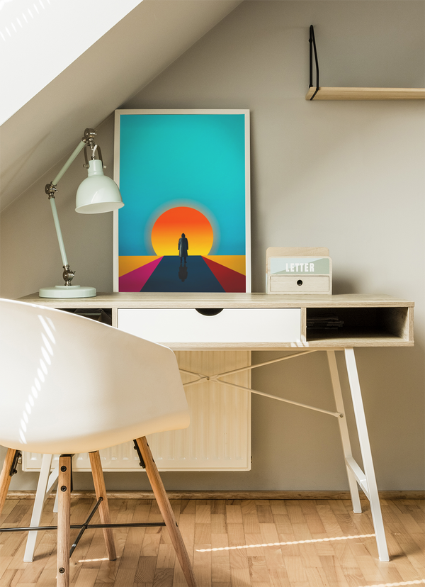 Modern home office with a desk, chair, and colorful wall art.